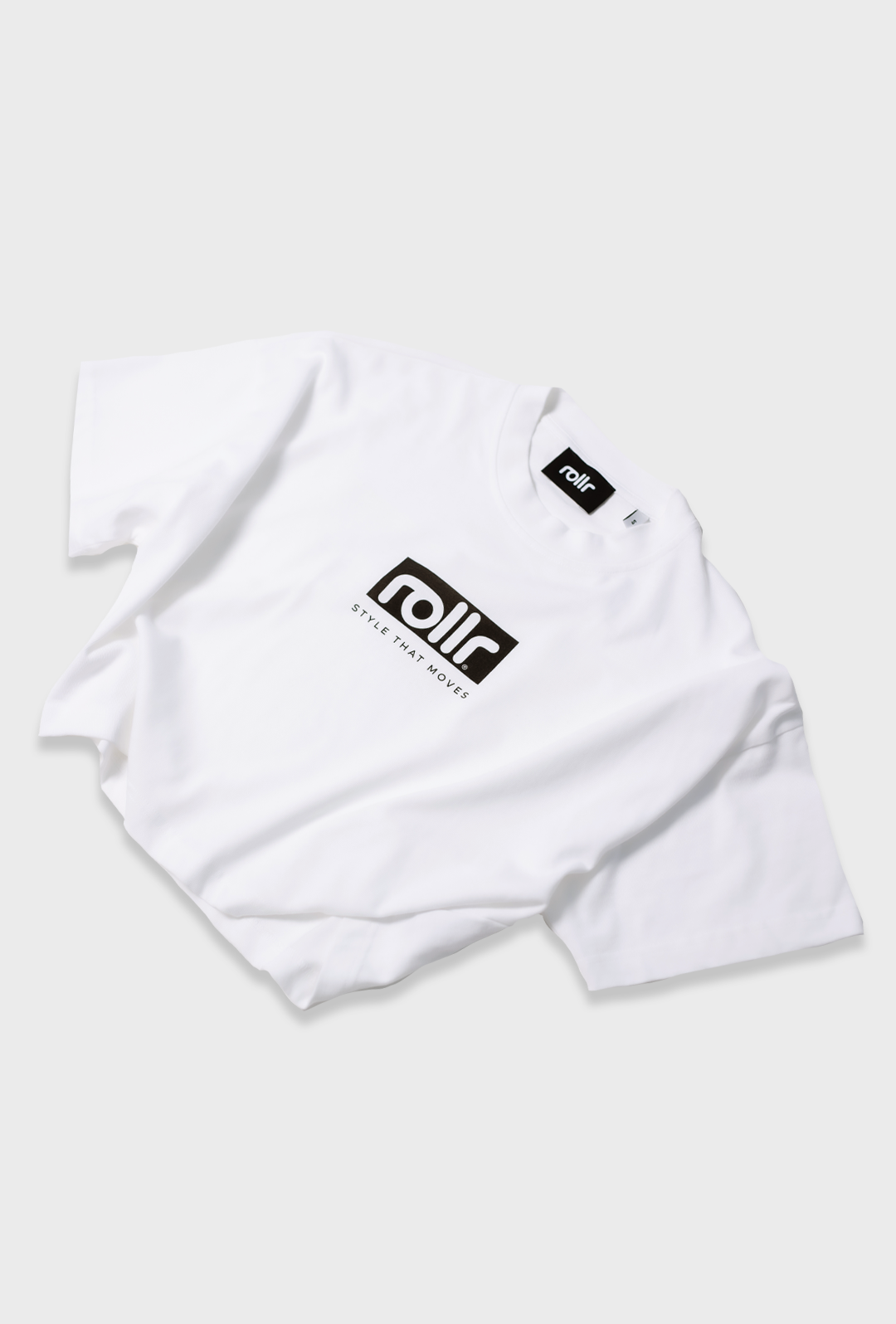 rollr clothing polar white womens cropped tee for women by roller clothing, with rollr logo and style that moves printed tagline